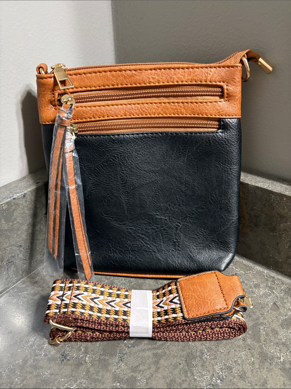 Black and Tan Two-Tone Crossbody Bag with Tassel Accent